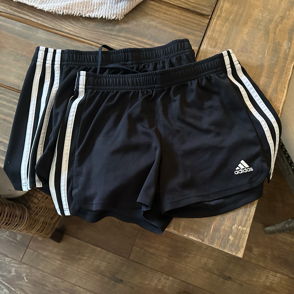 2 pairs of Adidas girl’s black soccer shorts, size 10/12 in great condition.